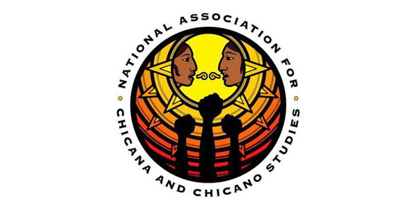 A circle with the words "National Association for Chicana and Chicano Studies" wrapped around the border. inside the circle are three raised fists and inside a sun symbol, the faces of two indigenous people in profile, facing each other, with the Nahuatl symbol for communication between them.